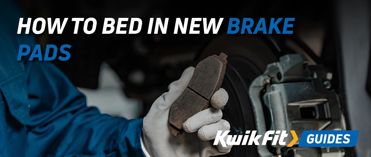 Technician holding a brake pad